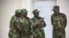 Members of a U.N.-backed Kenyan force stand at police headquarters ahead of a press conference in Port-au-Prince, Haiti, July 8, 2024.