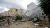 A man walks near damaged buildings, in the aftermath of Israeli strikes on Beirut's southern suburbs, Lebanon, Oct. 1, 2024. 