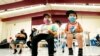 FILE - Oliver Estrada, 5, front left, waits with his brother Adriel, 2, after Estrada received the first dose of the Pfizer COVID-19 vaccine at an Adelante Healthcare community vaccine clinic at Joseph Zito Elementary School, in Phoenix, Nov. 6, 2021. 