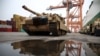 FILE PHOTO: Abrams tank from U.S. 2nd Armored Brigade Combat Team (ABCT) military equipment is unloaded in the Polish port of Gdynia