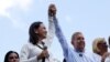 FILE PHOTO: Opposition leader Maria Corina Machado and opposition candidate Edmundo Gonzalez gesture as they address supporters