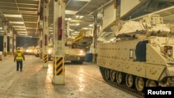 FILE PHOTO: Ukraine-bound Bradley Fighting Vehicles load onto ship in South Carolina