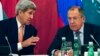 U.S. Secretary of State John Kerry (L) talks to Russian Foreign Minister Sergey Lavrov during a photo opportunity before a meeting in Vienna, Austria, Oct. 30, 2015.