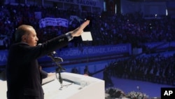 Turkish President Recep Tayyip Erdogan addresses voters in Gaziantep, Turkey, Oct. 24, 2015, in apparent breach of law that calls for his neutrality in elections campaigns..