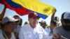 (FILES) The Venezuelan opposition presidential candidate for the Plataforma Unitaria Democratica party, Edmundo Gonzalez Urrutia (C), greets supporters upon his arrival at the campaign act in Barlovento Town in Miranda State, Venezuela, on June 26, 2024.