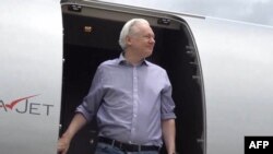 This screen shot courtesy of the WikiLeaks X account @wikileaks posted on June 25, 2024 shows WikiLeaks founder Julian Assange stepping off his flight from London upon arriving in Bangkok for a layover at Don Mueang International Airport in the Thai capit